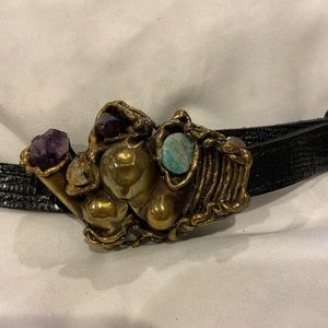 1/2” black belt with a beautiful stone and metal buckle.